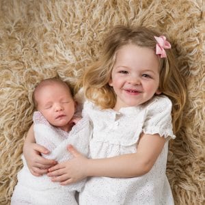 newborn portrait with sister